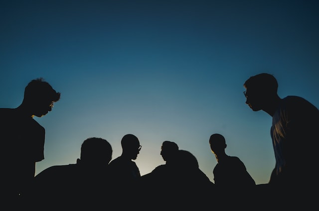 The silhouette of a group of people